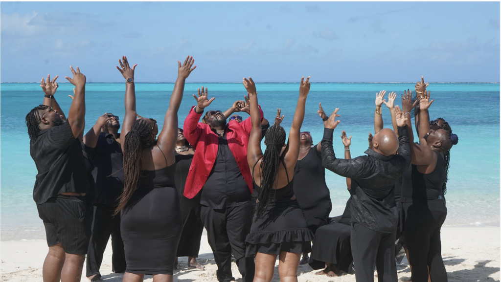 Home Large group beach photoshoot celebrating on the sand in Providenciales, Turks and Caicos